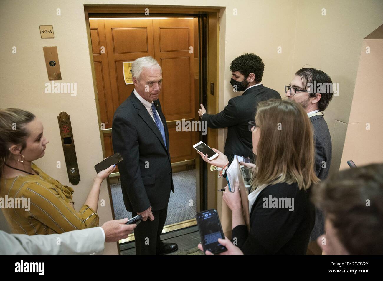 Washington, United States. 27th May, 2021. Senator Ron Johnson (R-WI) talks to reporters as he boards an elevator for the Senate floor to vote at the US Capitol in Washington, DC on Thursday, May 27, 2021. Senators will vote on infrastructure and a January 6th commission. Photo by Sarah Silbiger/UPI Credit: UPI/Alamy Live News Stock Photo