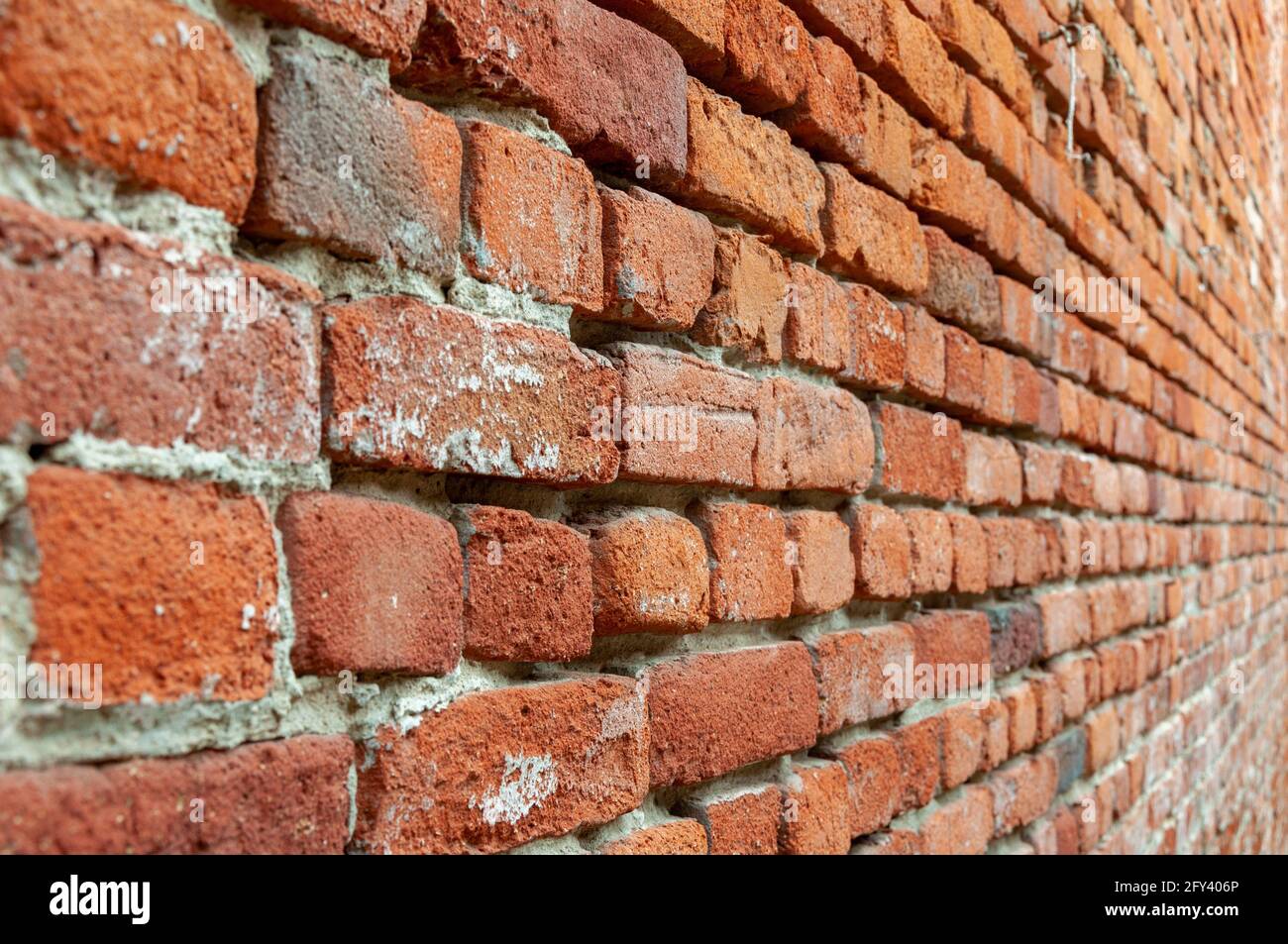 Red Brick Wall With Diminishing Perspective. Fragment of brown brick
