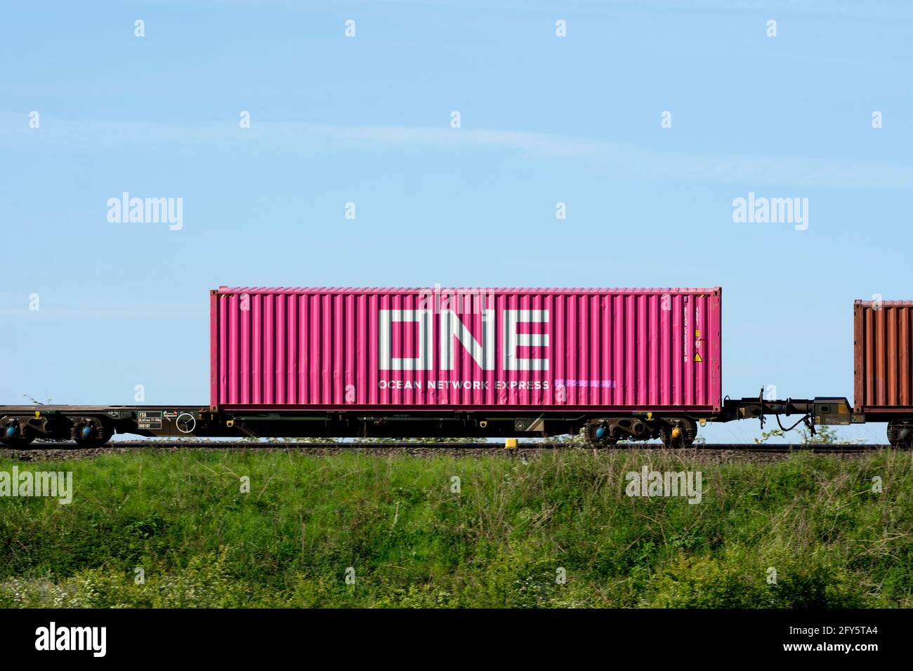 Ocean Network Express shipping container on a freightliner train
