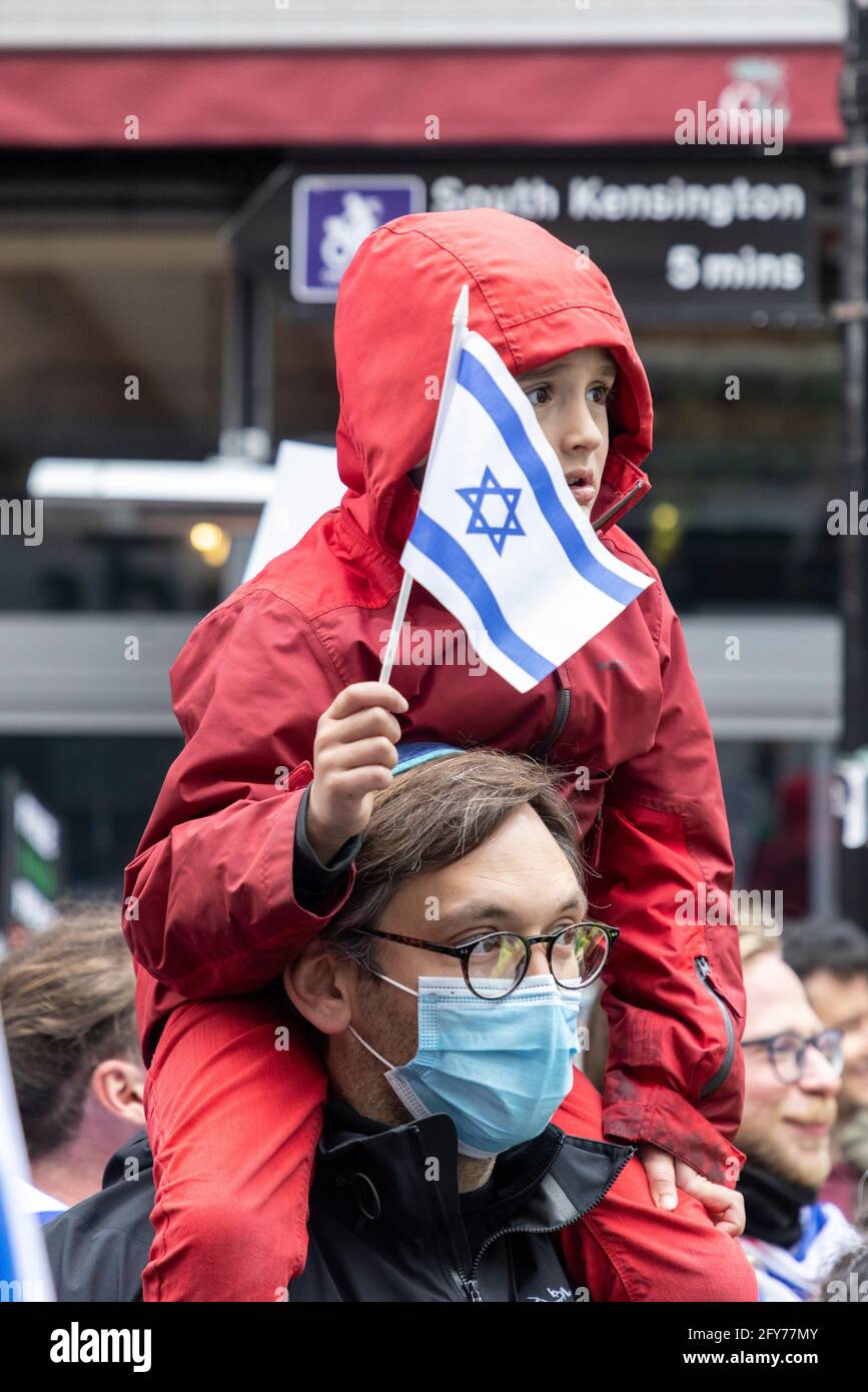 A child with Israeli flag, Zionist demonstration, Embassy of Israel, London, 23 May 2021 Stock Photo