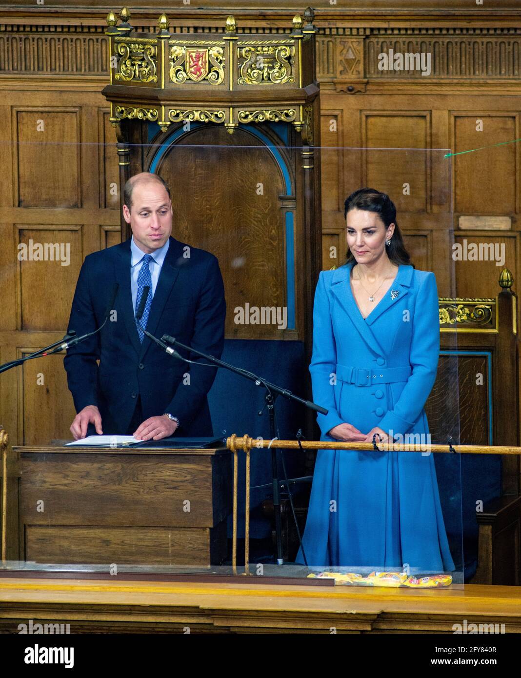 Edinburgh, Scotland, UK. Thursday 27th of May 2021 General Assembly of the Church of Scotland 2021: Day Five. Thursday May 27. Moderator, Lord Wallace. His Grace, The Earl of Strathearn, Duke of Cambridge Prince William and Her Royal Highness The Duchess of Cambridge attend the closing ceremony of the General Assembly in Edinburgh. The yellow packets in front of the Royal couple are Jelly Babies sweetsCredit: Andrew O'Brien/Alamy Live News Stock Photo