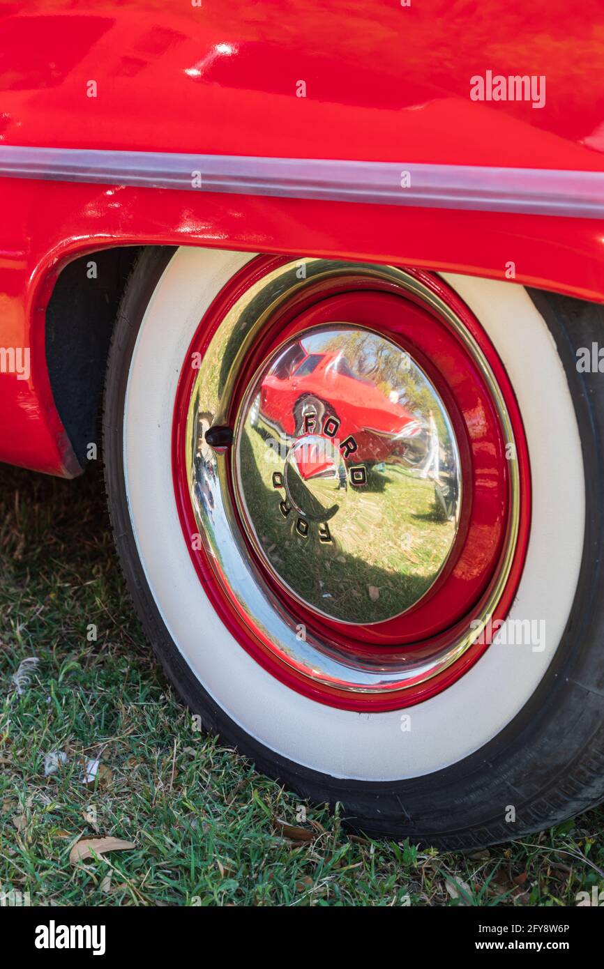 Marble Falls, Texas, USA. April 10, 2021. Whitewall tire and chrome hub cap on a vintage Ford. Stock Photo