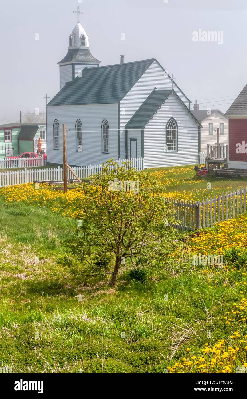 Church of the Most Holy Trinity at Trinity in Newfoundland on a foggy day. It is the oldest standing wooden church in Newfoundland & was built in 1833 Stock Photo