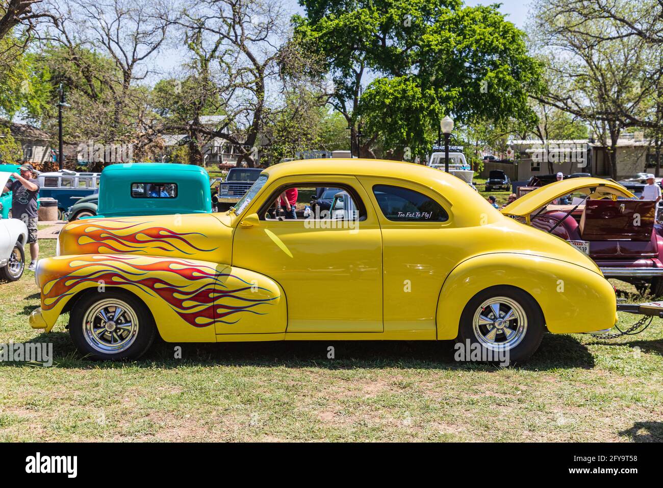 Marble Falls, Texas, USA. April 10, 2021. Yellow vintage hot rod with