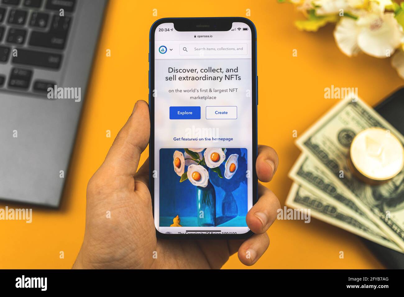 Kharkov, Ukraine - May 27, 2021: Man hold mobile phone with opened Opensea. io online website of NFT marketplace for crypto art, business and freelance  Stock Photo - Alamy