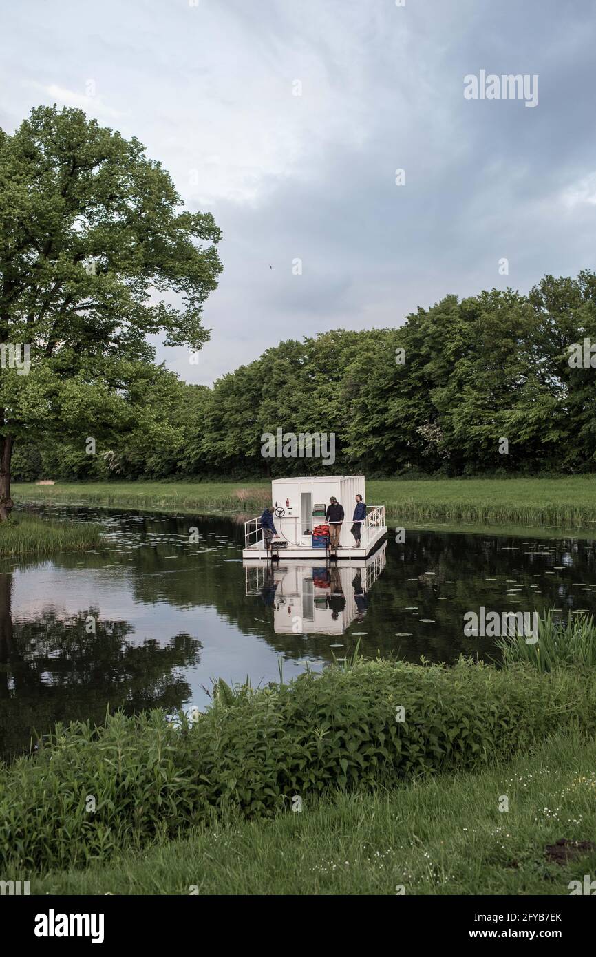 Hanover, Germany. 27th May, 2021. During the KunstFestSpiele Herrenhausen, members of the artist group YRD.Works will be sailing across the Graft in the Great Garden. A raft measuring about nine by three meters was built especially for the Kunstfestspiele, and guests listen to a sound collage on an audio guide during the approximately 40-minute trip. Credit: Eman Helal/dpa/Alamy Live News Stock Photo