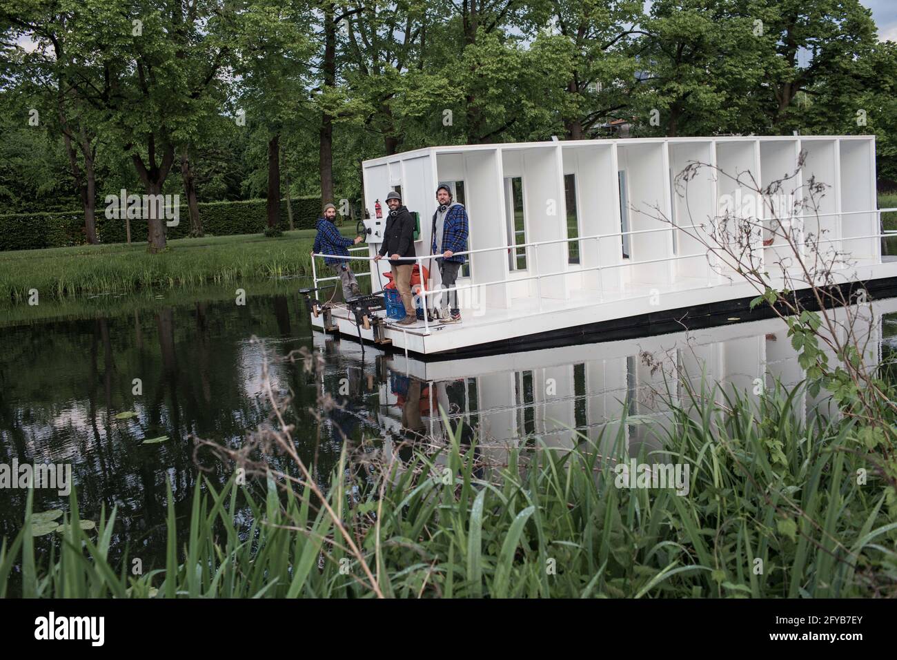 Hanover, Germany. 27th May, 2021. During the KunstFestSpiele Herrenhausen, members of the artist group YRD.Works will be sailing across the Graft in the Great Garden. A raft measuring about nine by three meters was built especially for the Kunstfestspiele, and guests listen to a sound collage on an audio guide during the approximately 40-minute trip. Credit: Eman Helal/dpa/Alamy Live News Stock Photo