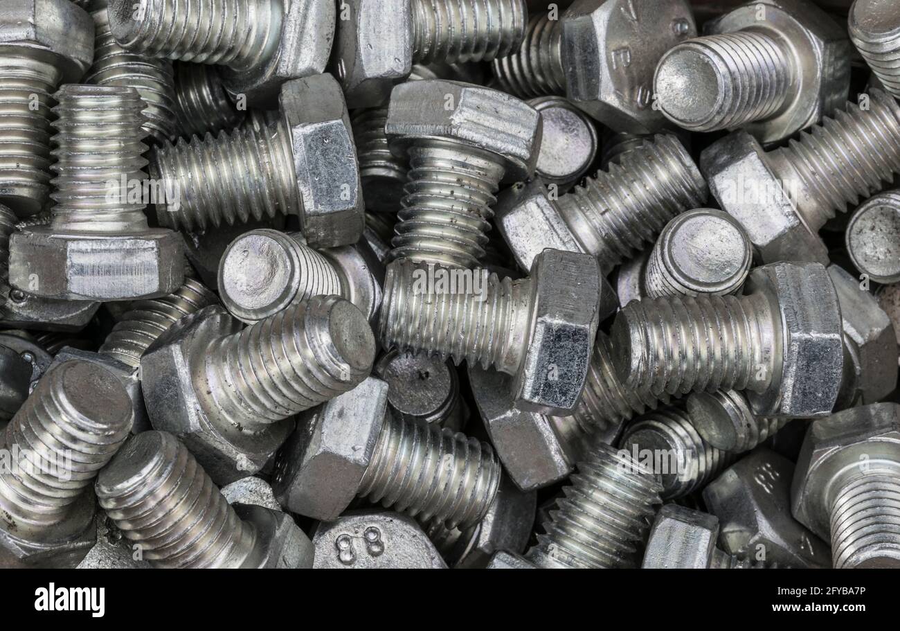 background pattern made from industrial screws Stock Photo