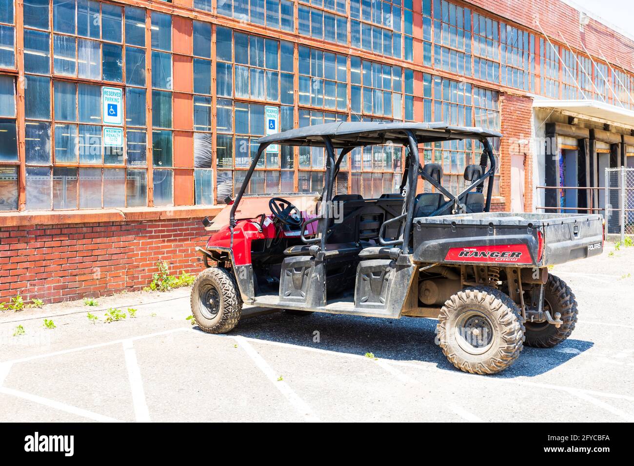 CHARLOTTE, NC, USA-23 MAY 2021: Camp North End. Polaris Ranger Crew vehicle parked at old industrial building. Stock Photo
