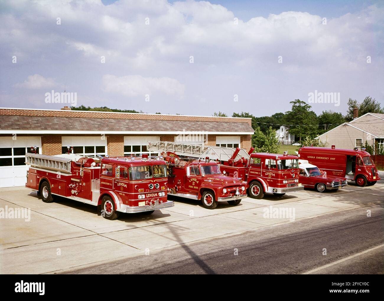 1960s 5 EMERGENCY VEHICLES TRUCKS INCLUDING AN AMBULANCE IN FRONT OF THE VOLUNTEER FIRE DEPARTMENT BUILDING IN LENOLA NJ USA - kf6289 HAR001 HARS WIDE ANGLE FIREMAN DISASTER ADVENTURE PROTECTION STRENGTH COURAGE EXTERIOR KNOWLEDGE POWERFUL PROGRESS PRIDE ON AUTHORITY NJ OCCUPATIONS FIREMEN CONCEPTUAL STYLISH SUPPORT VEHICLES NEW JERSEY SMALL TOWN COOPERATION FIREFIGHTERS FIRES GROWTH TOGETHERNESS FIRE DEPARTMENT HAR001 INCLUDING OLD FASHIONED Stock Photo