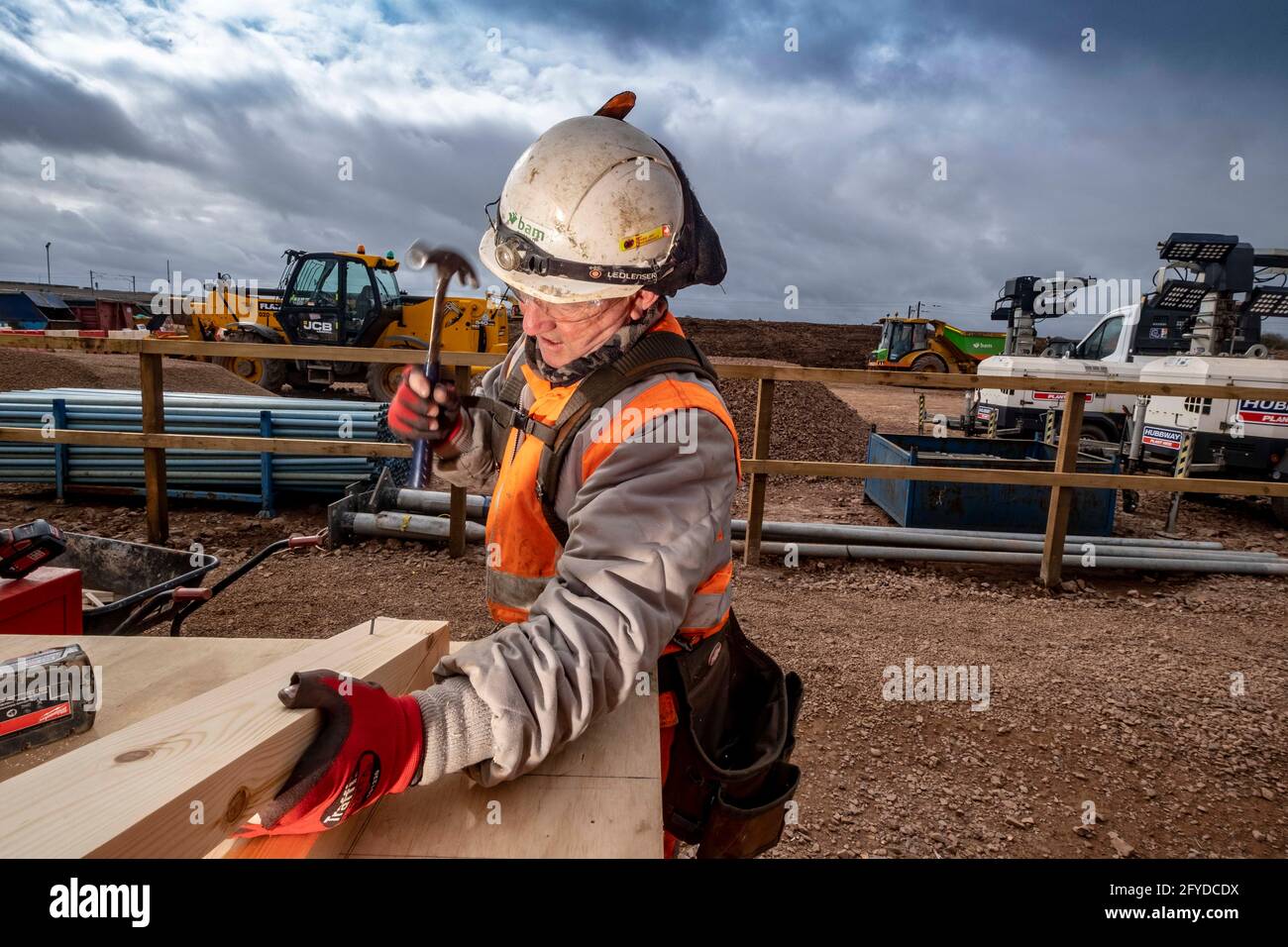Construction workers in action on construction site Stock Photo