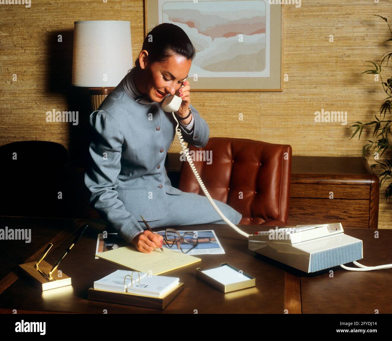 Powerful business woman desk hi-res stock photography and images - Alamy