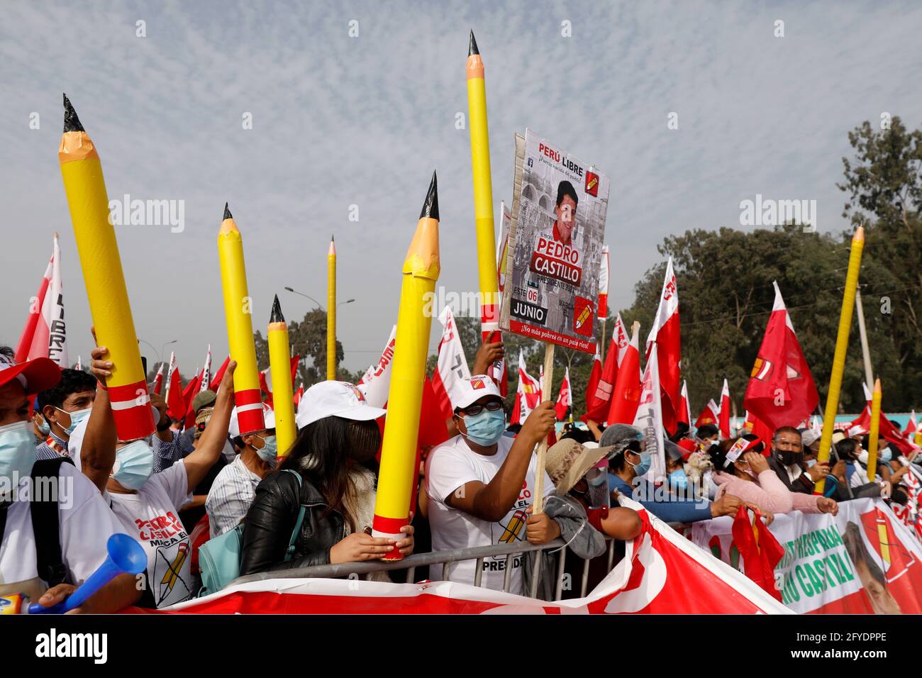 Lima, Peru. 26th May, 2021. People holding pencils, the symbol of the party, attend a campaign rally for Presidential candidate Pedro Castillo, in Villa El Salvador neighborhood. On June 6 Peruvians will go to the polls to elect new President between Castillo and Keiko Fujimori. Credit: Mariana Bazo/ZUMA Wire/Alamy Live News Stock Photo