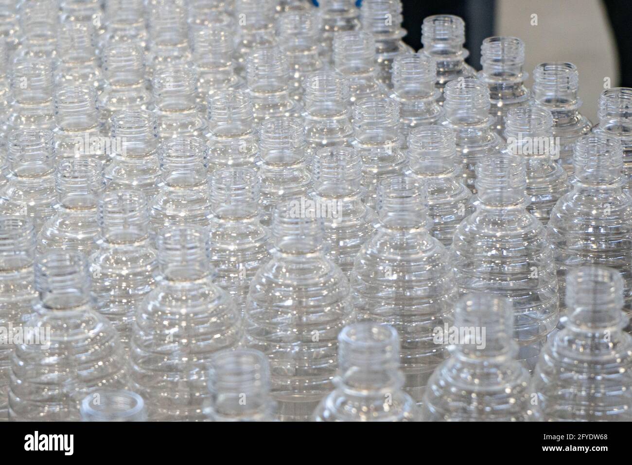 The various type of plastic bottle product and preform material with injection mold background