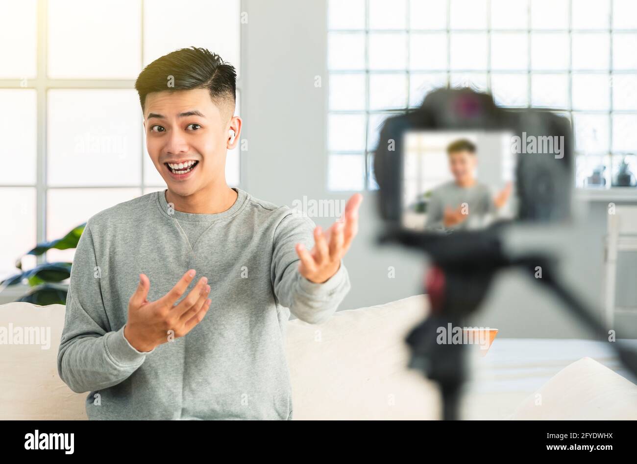 Young man recording video for an internet reportage or tutorial streaming Stock Photo