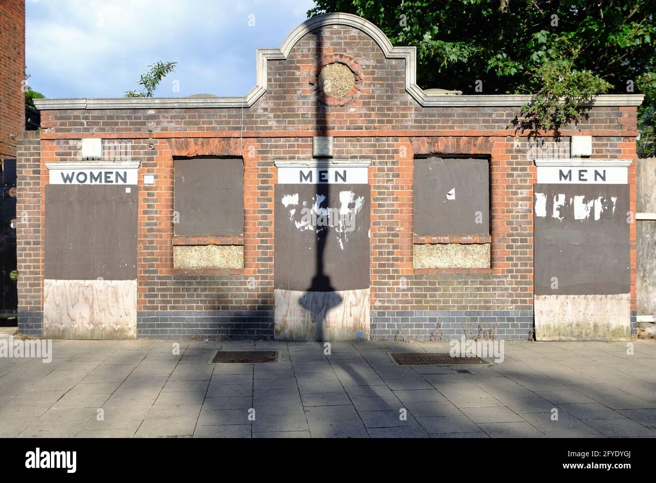 London, UK. Disused and boarded up Victorian toilet block in High Road, Tottenham. Stock Photo