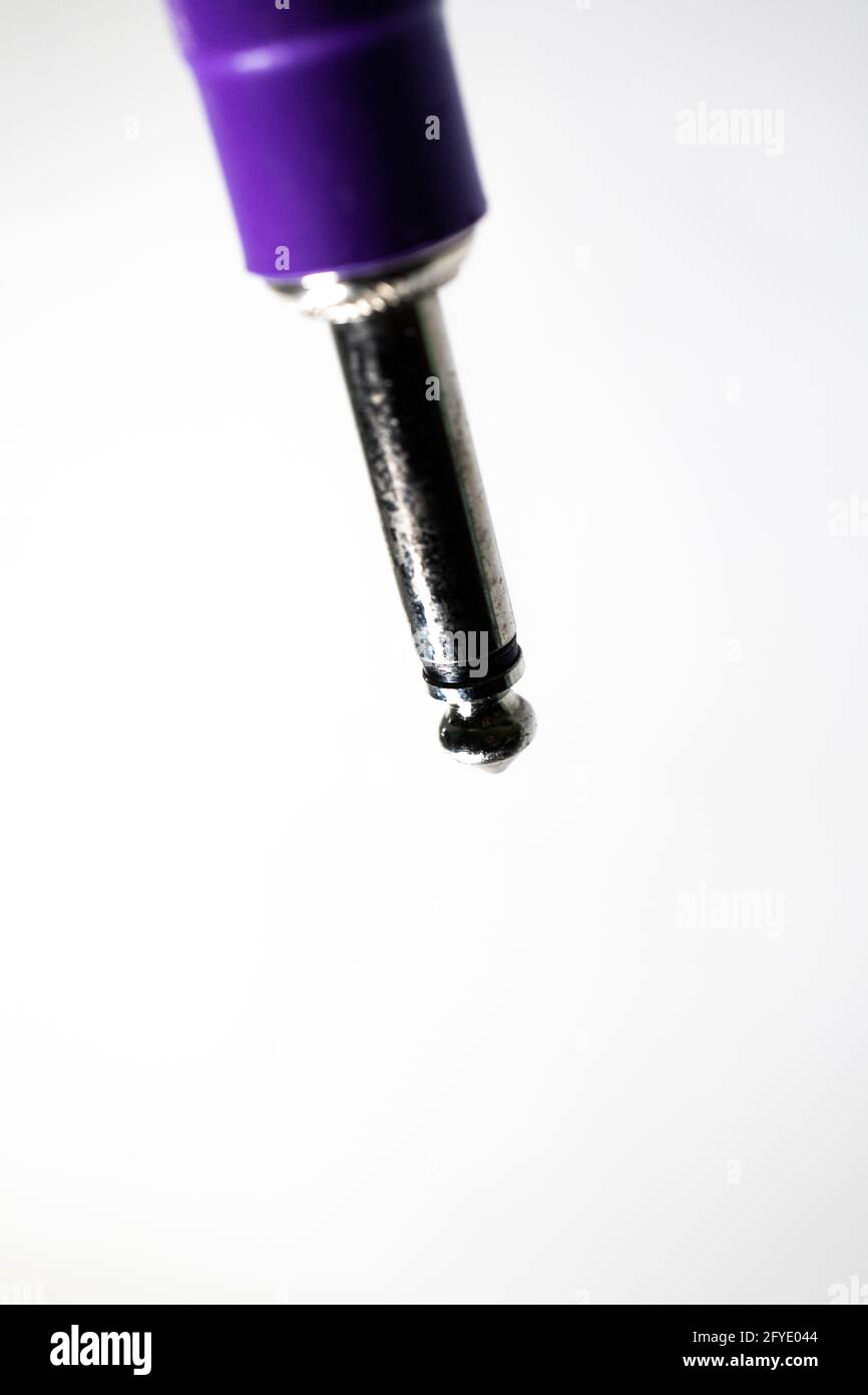 Macro closeup of tip on male connector of quarter inch instrument cable