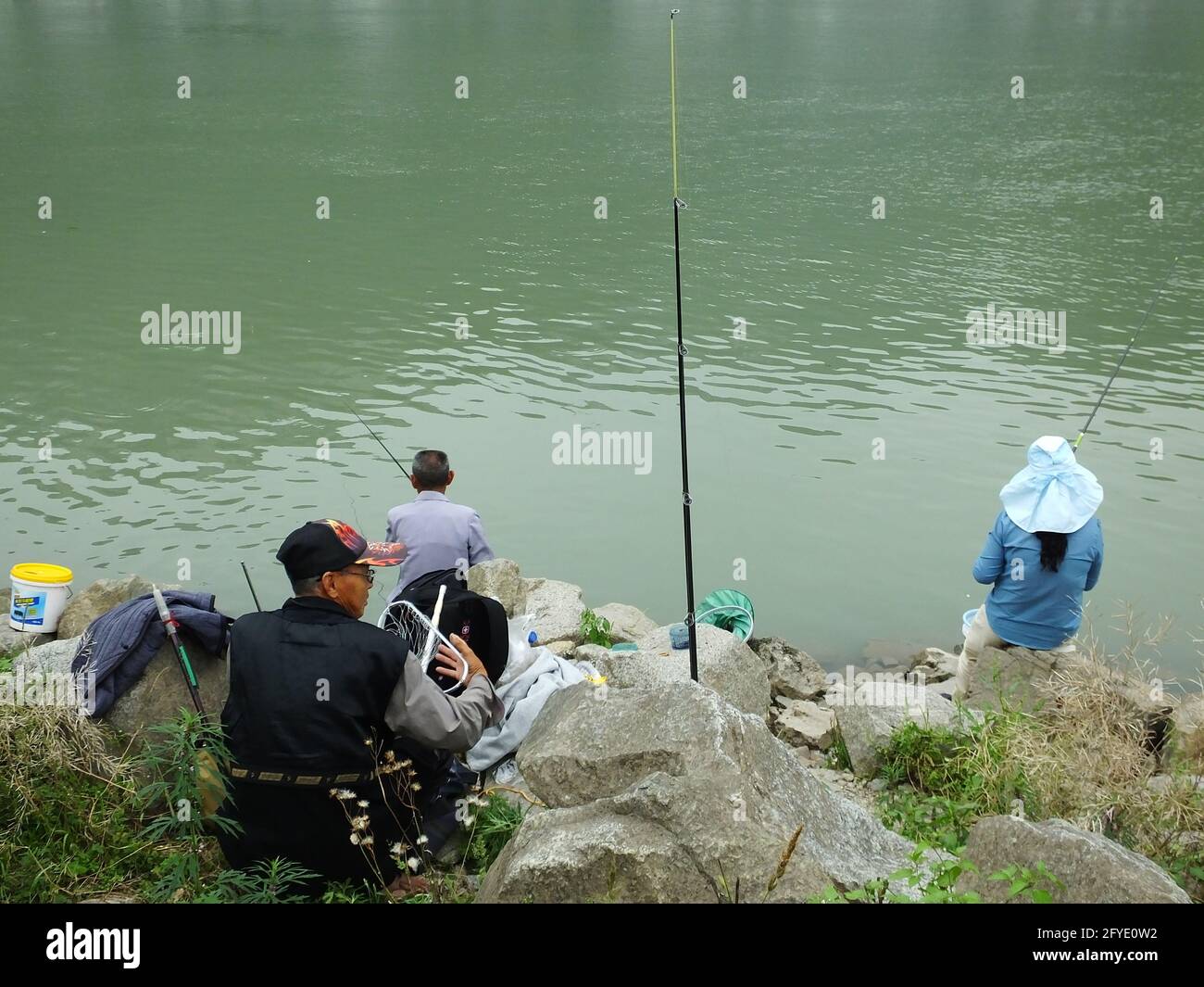 Xiling Fish Roe YICHANG, CHINA - MAY 27, 2021 - Fishing enthusiasts fish on the banks ...