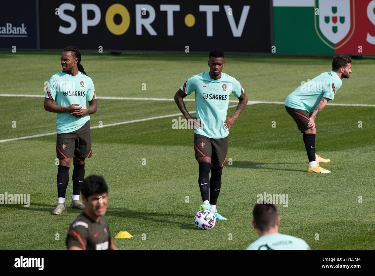 Oeiras, Portugal. 27th May, 2021. Renato Sanches (L), Nelson Semedo (C) and Rafa Silva (R) are seen in action during the training session at Cidade do Futebol training ground in Oeiras.Portugal football team trains for the first time before competing in the European football championship - EURO 2020 - scheduled to start on June 11th. Credit: SOPA Images Limited/Alamy Live News Stock Photo