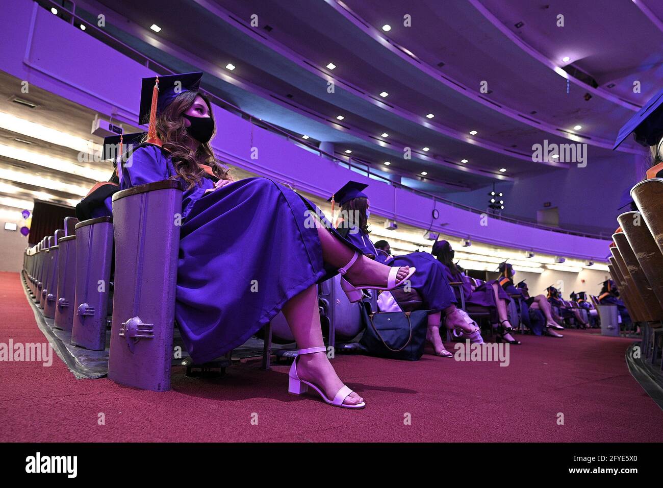 New York, USA. 27th May, 2021. Graduates maintain social distancing during the first in-person ceremony since the fall of 2019, for the Hunter College School of Nursing graduating class of 2021, in New York, NY, May 27, 2021. The ceremony was also held virtually for those not able to participate, very few guests were able to attend, as proof of vaccination and a negative COVID-19 test was required. (Photo by Anthony Behar/Sipa USA) Credit: Sipa USA/Alamy Live News Stock Photo