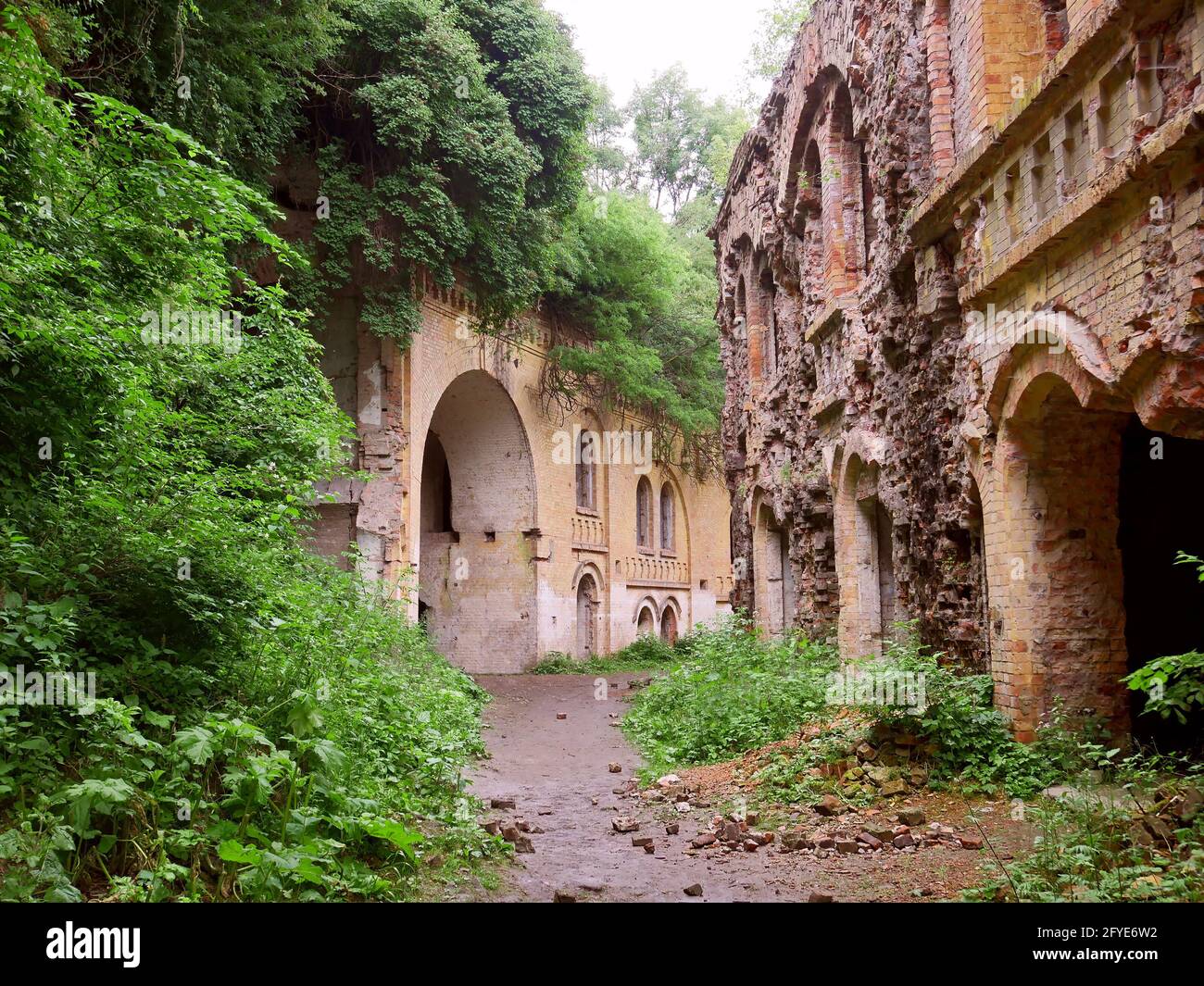 Part of a unique old abandoned big military fortification of the second half of 19th century in Rivne region, Ukraine. Rainy day, early summer, rapid Stock Photo
