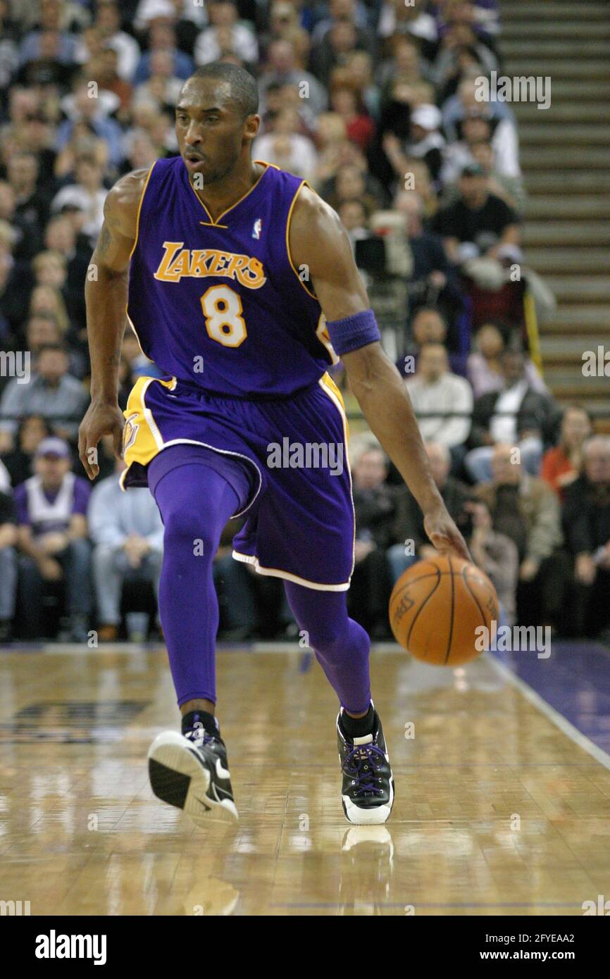 SACRAMENTO, UNITED STATES - Mar 14, 2006: Kobe Bryant doing a jump Lay up against Sacramento Kings. Stock Photo