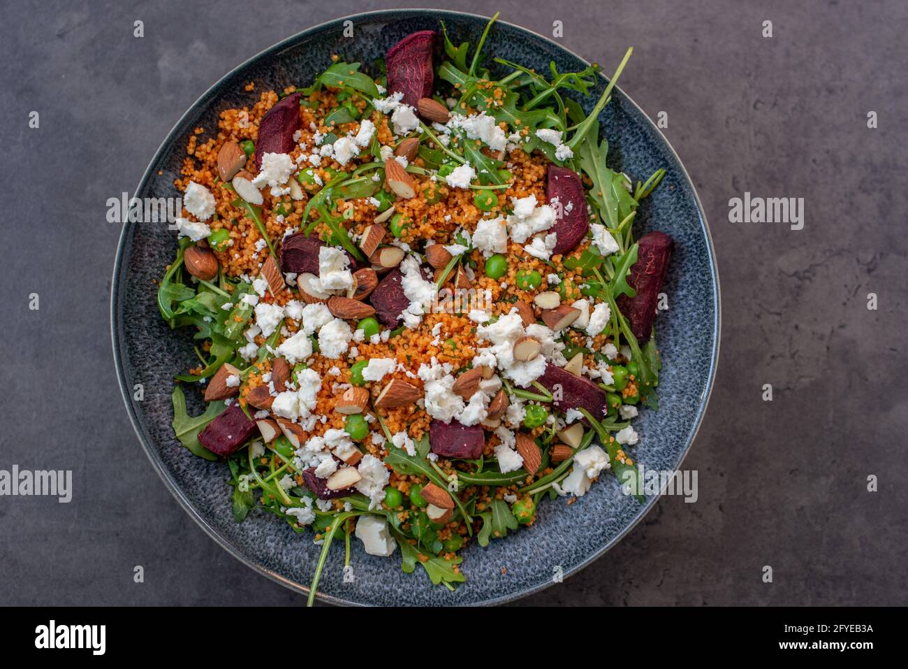 healthy home made couscous salad with sweet potato, beetroot and feta cheese Stock Photo