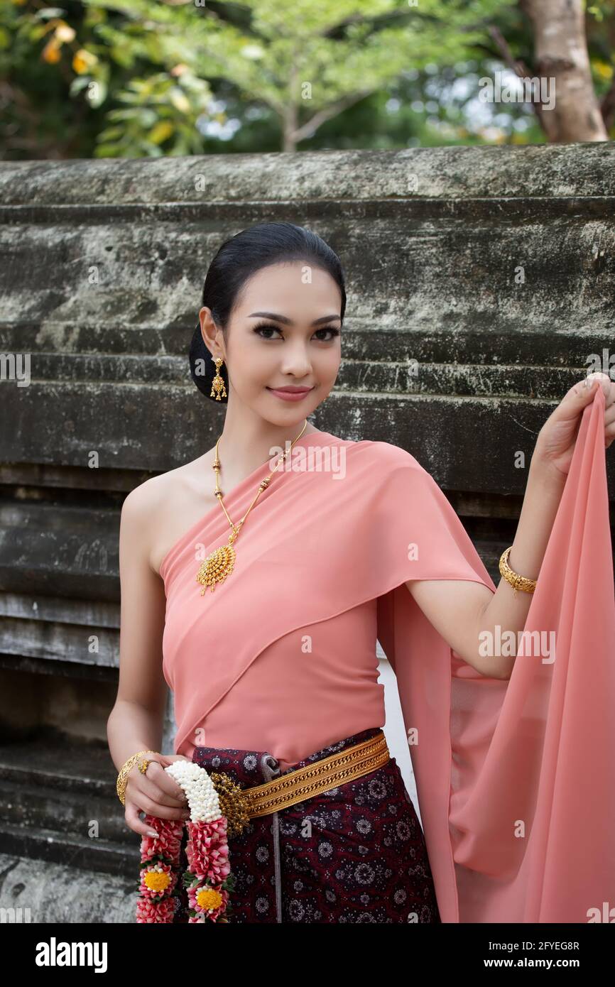 Beautiful woman, Thai national costume, traditional Thai dress, Thai woman,  good mood, beautiful smile background - Image with noise and grain Stock  Photo - Alamy