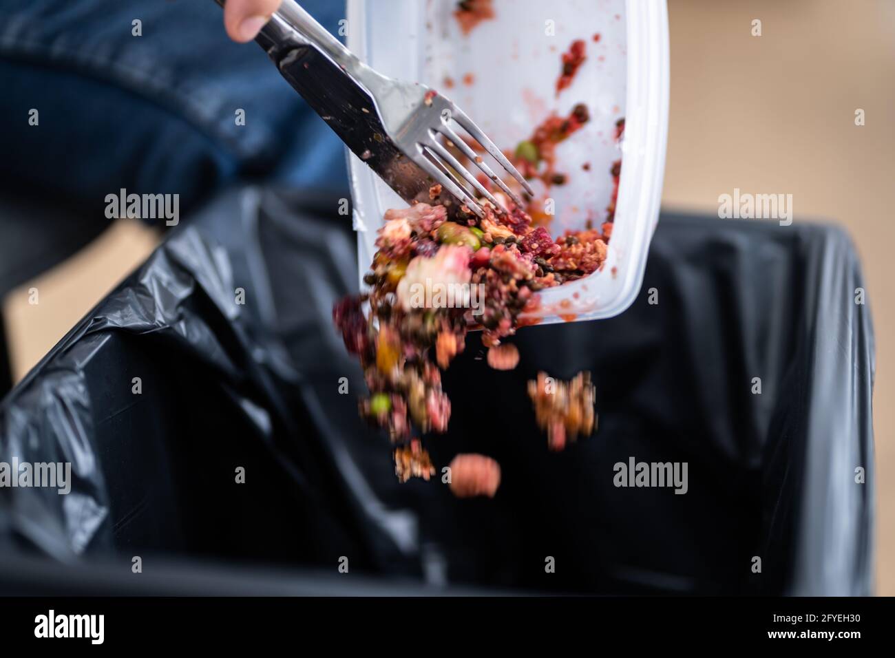 Throwing Away Food Leftover. Discarded Meal In Trash Stock Photo Alamy