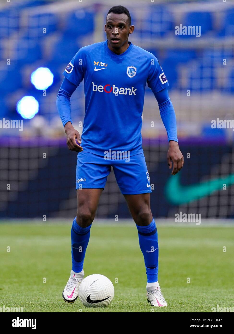 GENK, BELGIUM - MAY 20: Jhon Lucumi of KRC Genk controlls the ball during the Jupiler Pro League match between KRC Genk and Royal Antwerp FC at Luminu Stock Photo