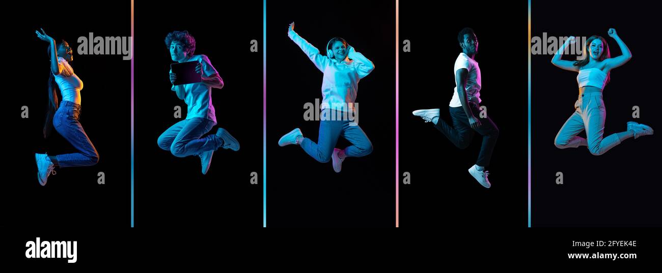 Collage of young men and women jumping isolated on dack background in neon. Flyer Stock Photo