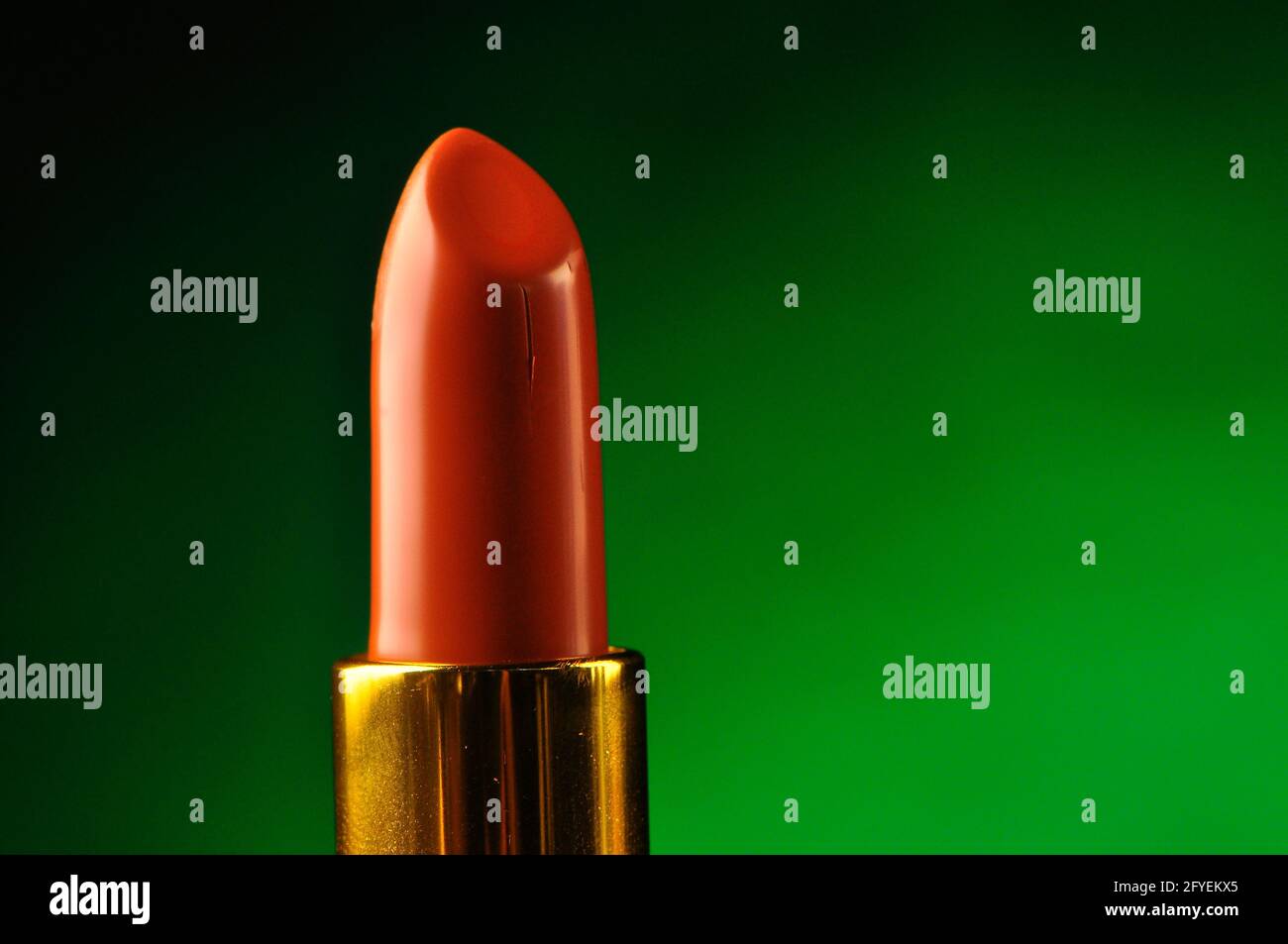 Lipstick on a green background Stock Photo