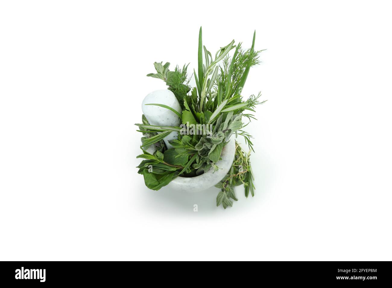 Mortar with herbs isolated on white background Stock Photo
