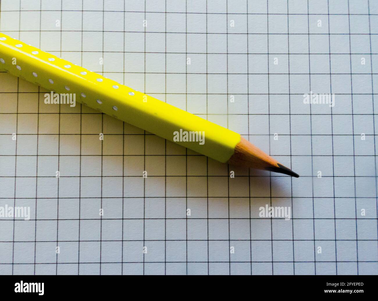 yellow pencil on a notebook Stock Photo