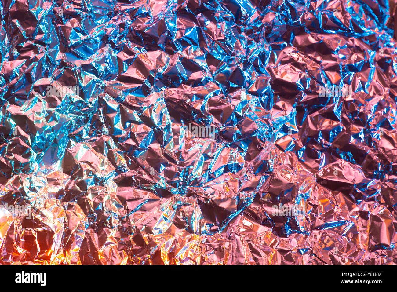 https://c8.alamy.com/comp/2FYETBM/abstract-chrome-background-with-rose-gold-and-vibrant-blue-color-and-glossy-rough-texture-metall-foil-paper-crumpled-modern-glance-futuristic-backgr-2FYETBM.jpg