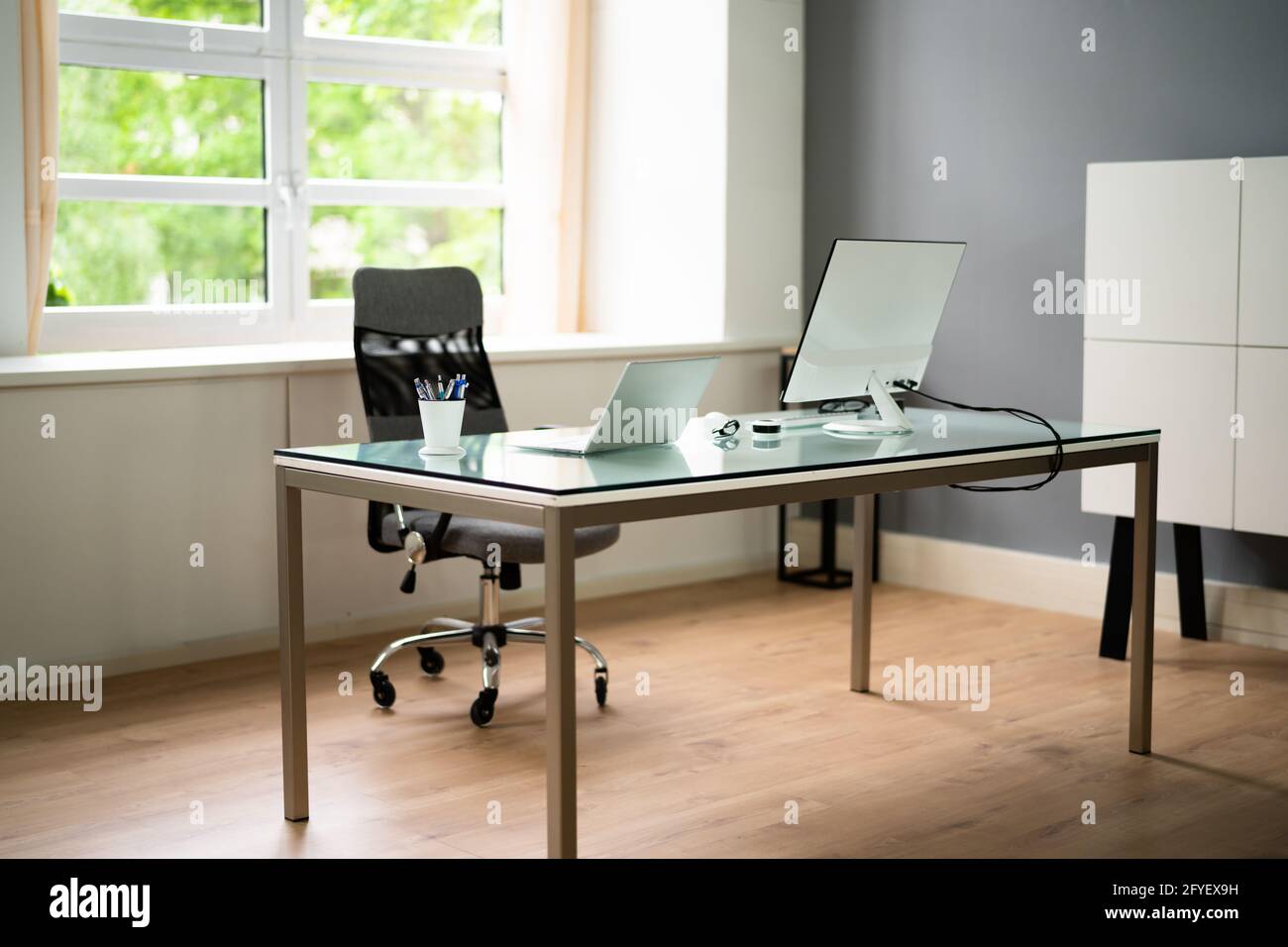 Office Room And Furniture With Computer Monitor Stock Photo