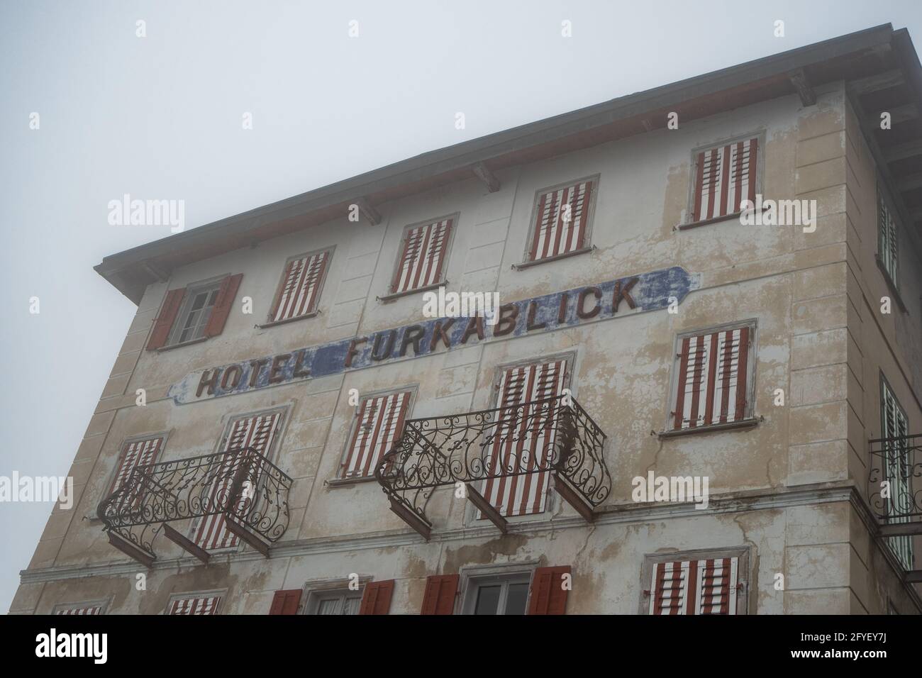 Furka pass, Switzerland - June 15th 2020: Closed hotel Furkablick in the fog Stock Photo