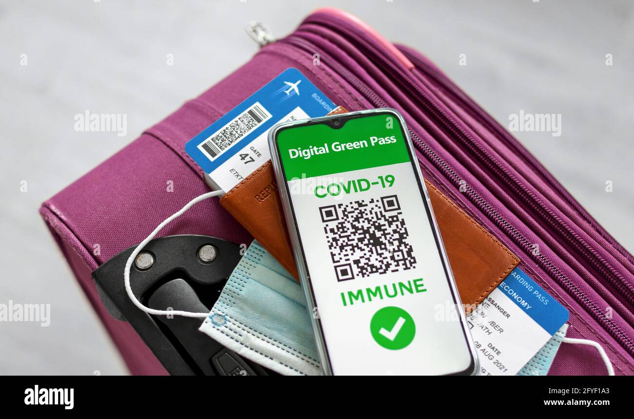 LJUBLJANA, SLOVENIA - May 22, 2021: Closeup top view image of suitcase and  travel documents. Covid pass in form of digital green certificate containin  Stock Photo - Alamy