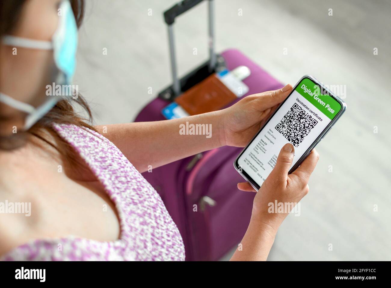 Top view of woman holding id documents and covid vaccination