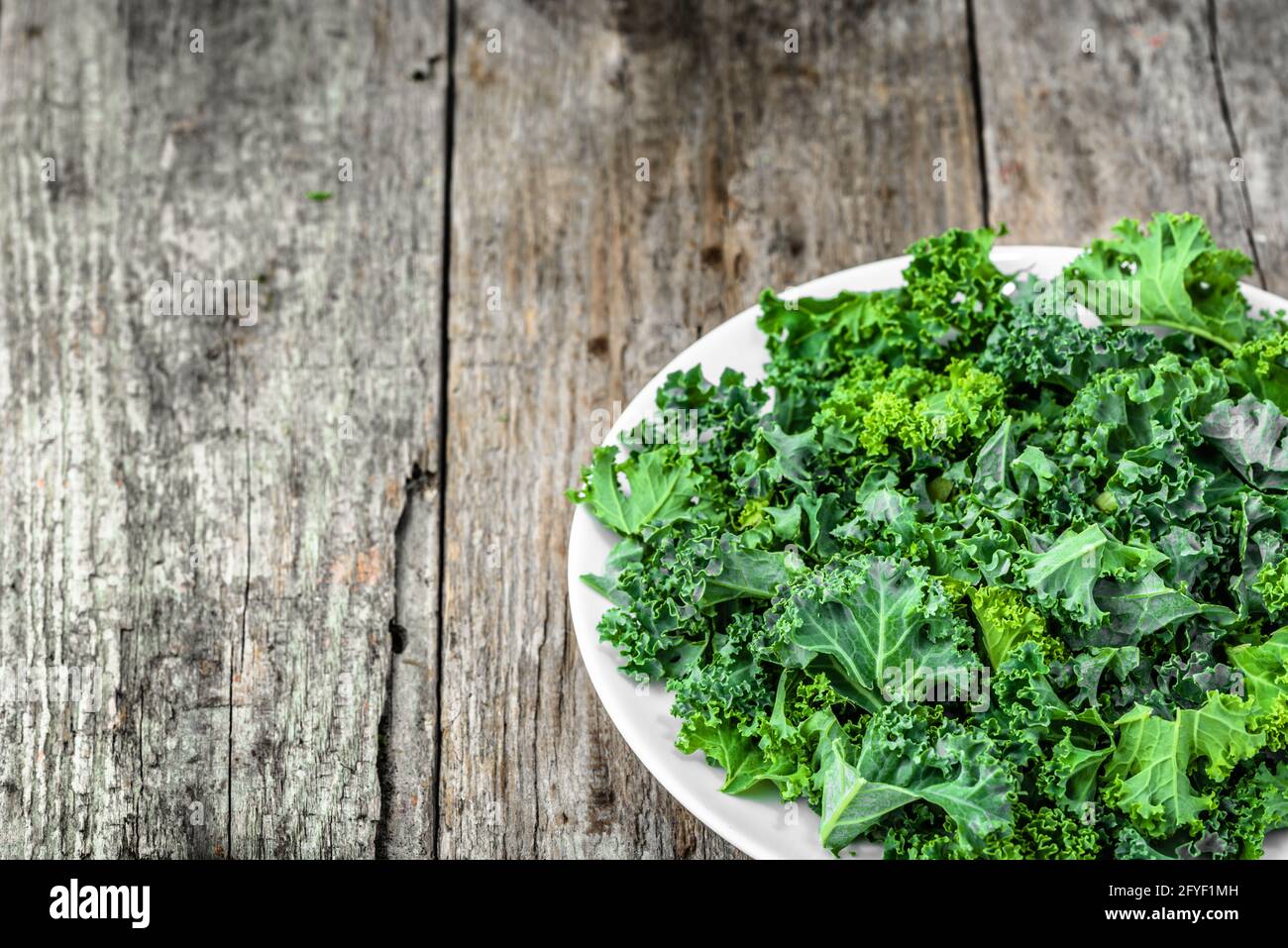 Green kale, healthy vegetable chips from sliced leaves, vegetarian food