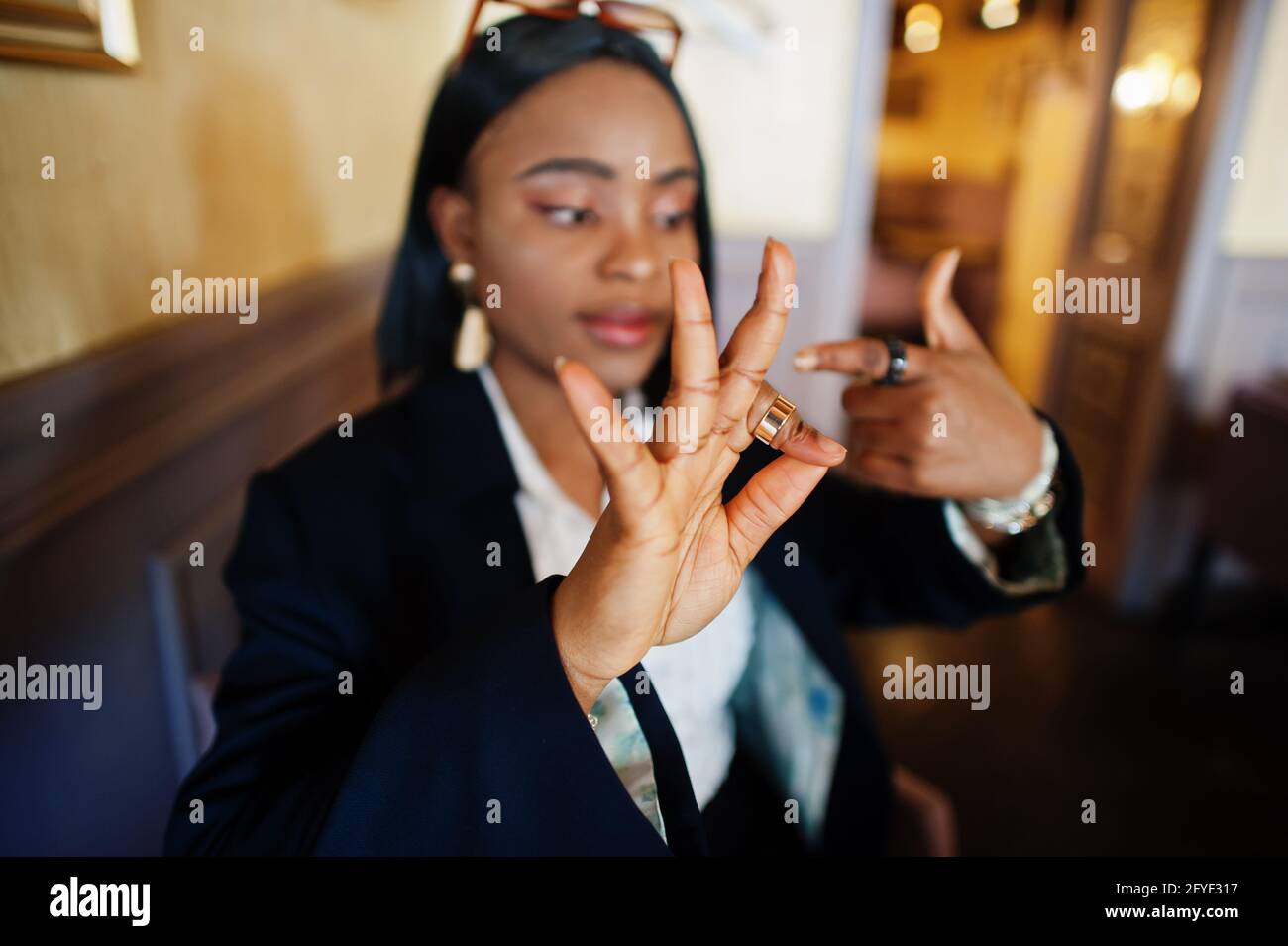 Young deaf mute african american woman using sign language Stock Photo