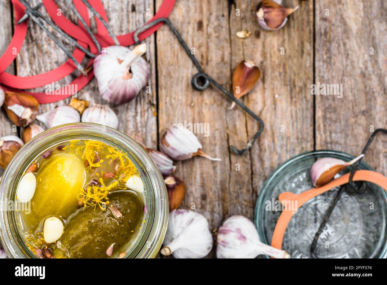 Homemade pickle preserves with garlic and dill. Pickled gherkins in jar