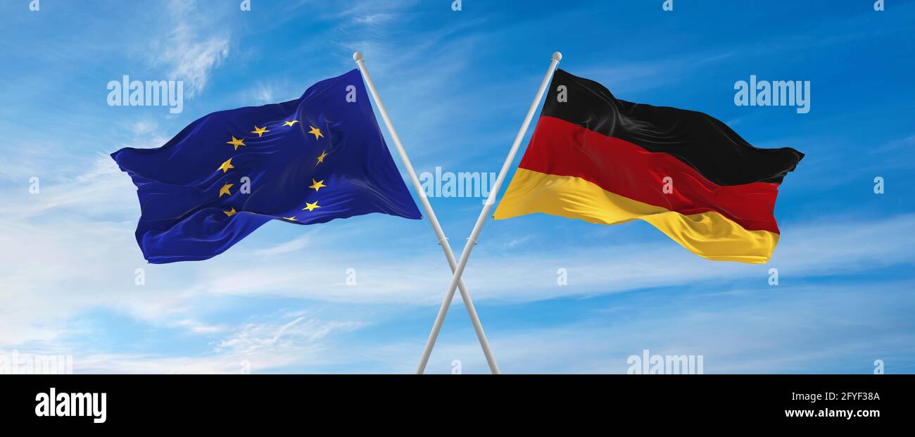 flags of European Union and Federal Republic of Germany waving in the ...