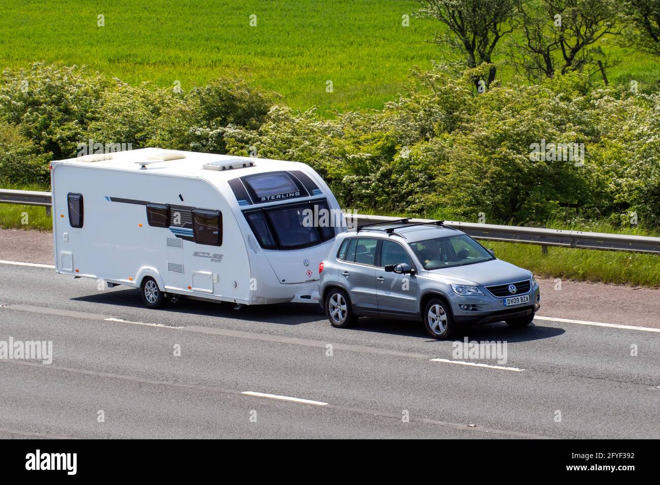 2009 silver VW Volkswagan Tiguan Escape Tdi 140 1968cc diesel SUV towing Sterling Eccles Sport caravan campervans on Britain's roads, RV leisure vehicle, family holidays, caravanette vacations, Touring caravan holiday, van conversions, Vanagon autohome, life on the road,  auto-sleeper Stock Photo