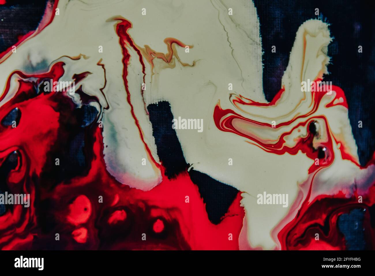 Abstract painting with mixed red and white oil paint colors Stock Photo