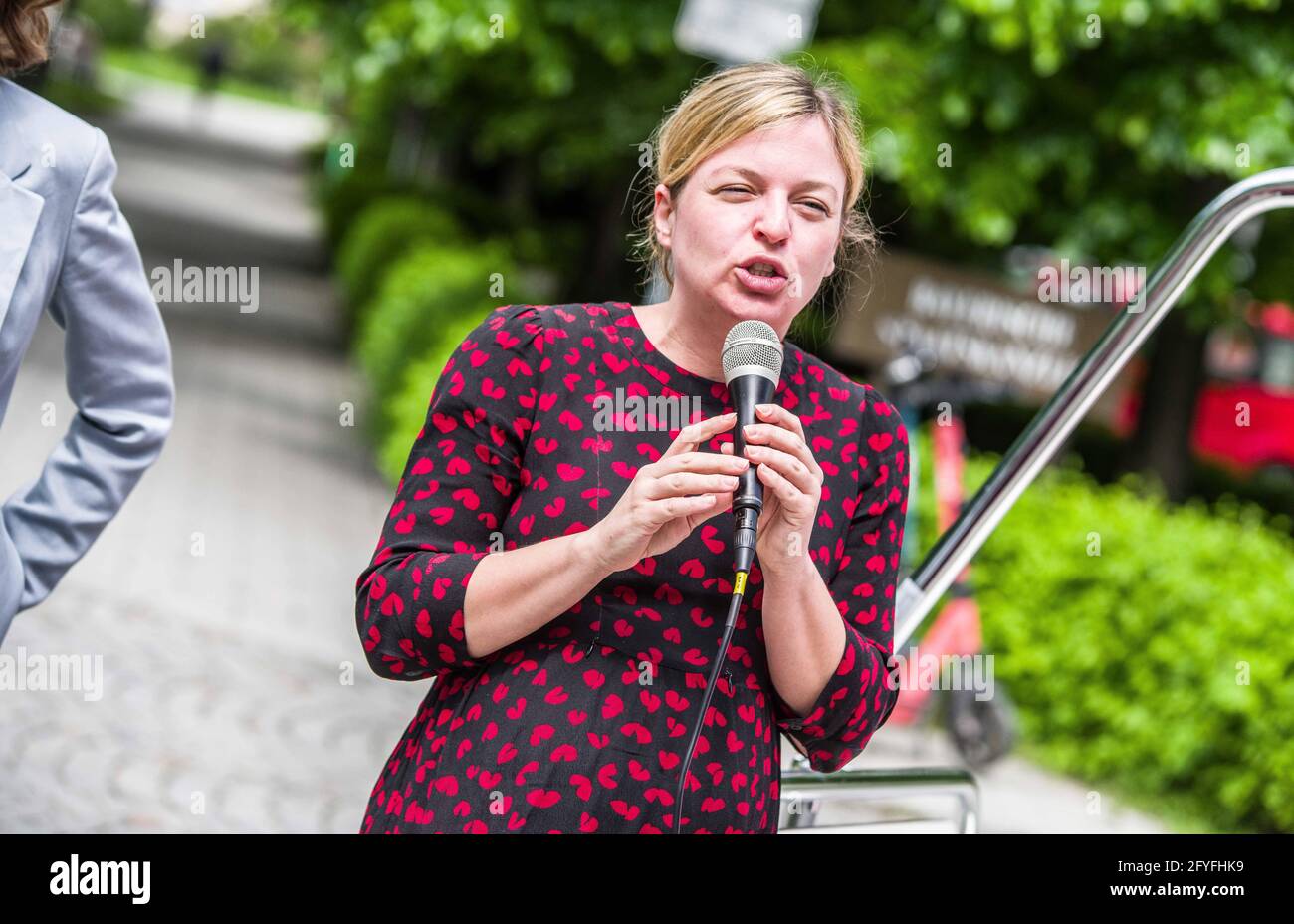 May 28, 2021, Munich, Bavaria, Germany: KATHARINA SCHULZE of the Bavarian Greens who often pointed at the Staatskanzlei while blaming ''the Soeder government'' for the poor working conditions for healthcare workers. The Bavarian Greens (die Gruenen/Buendnis90) organized a protest action at the Bavarian Staatskanzlei (government building) in support of healthcare workers. During the Coronavirus crisis, the working conditions for this sector have come into greater focus and The Greens are pushing for better politics for this sector where pay structures and working conditions are improved and th Stock Photo