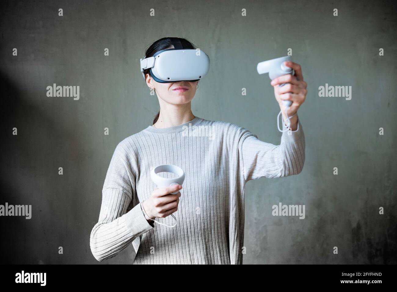 Woman using Virtual Reality Oculus Headset. Stock Photo