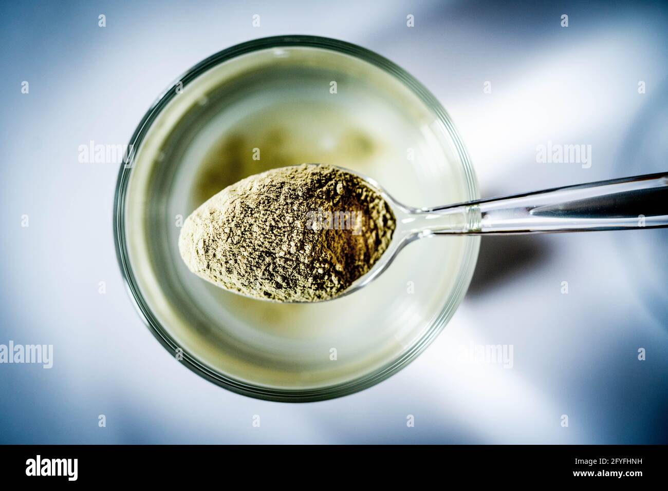 Preparation of green clay solution for intestinal confort. Stock Photo
