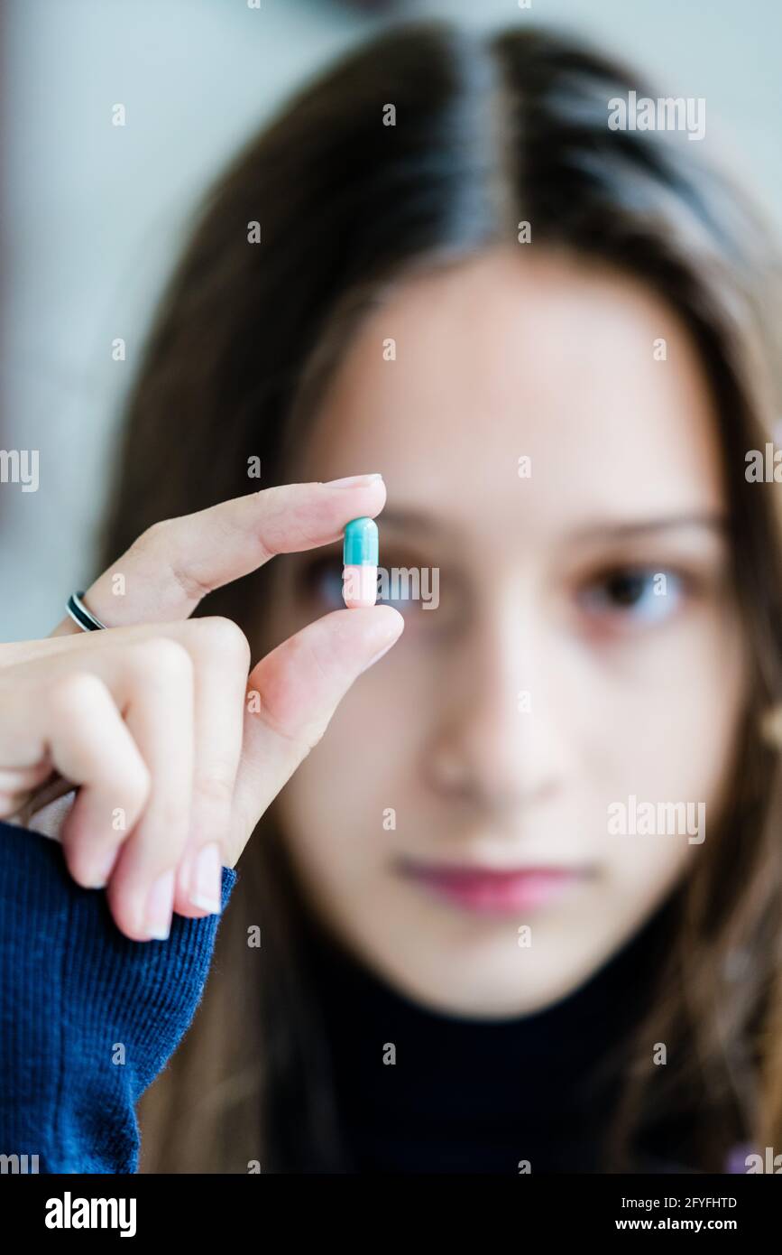 Young girl taking medicine. Stock Photo