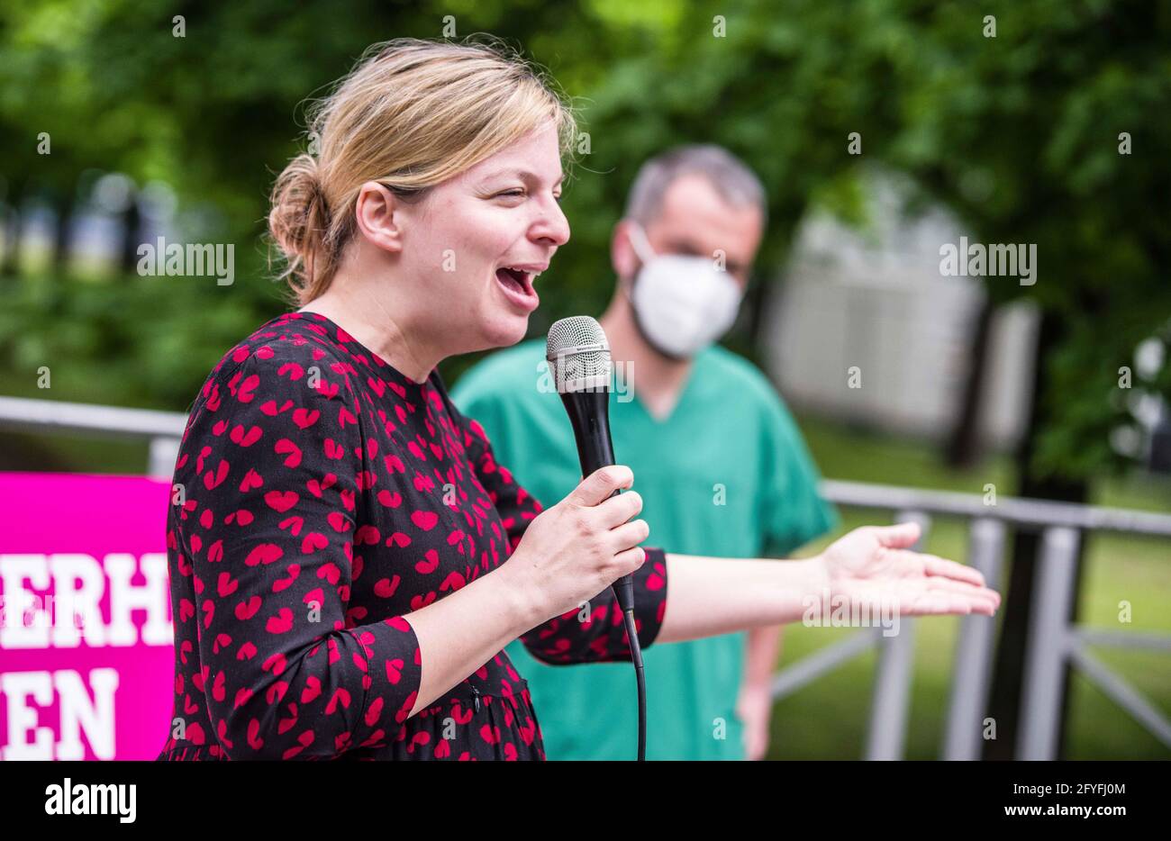 May 28, 2021, Munich, Bavaria, Germany: KATHARINA SCHULZE of the Bavarian Greens who often pointed at the Staatskanzlei while blaming ''the Soeder government'' for the poor working conditions for healthcare workers. The Bavarian Greens (die Gruenen/Buendnis90) organized a protest action at the Bavarian Staatskanzlei (government building) in support of healthcare workers. During the Coronavirus crisis, the working conditions for this sector have come into greater focus and The Greens are pushing for better politics for this sector where pay structures and working conditions are improved and th Stock Photo